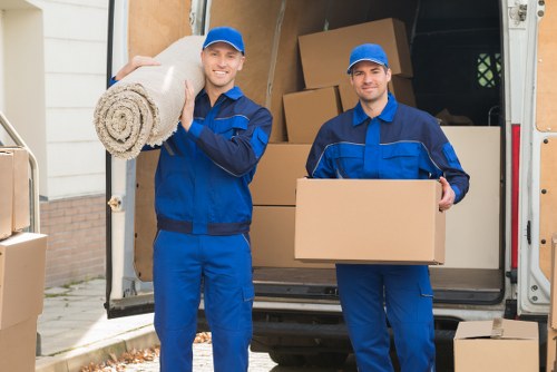 Removal team beginning a Dundee home move with careful handling of boxes
