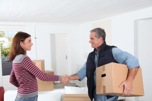 Packed office boxes and furniture ready for relocation in Dundee
