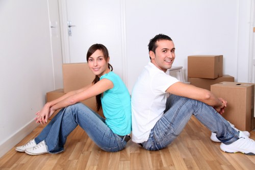 Commercial movers handling desks and equipment in a Dundee office