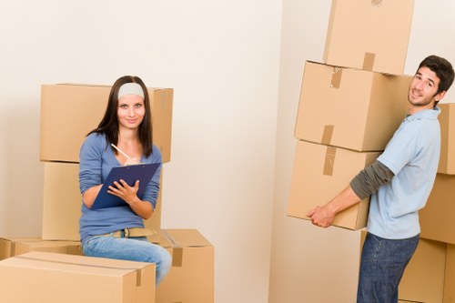 Removal team handling boxes and furniture for a house move in Dundee