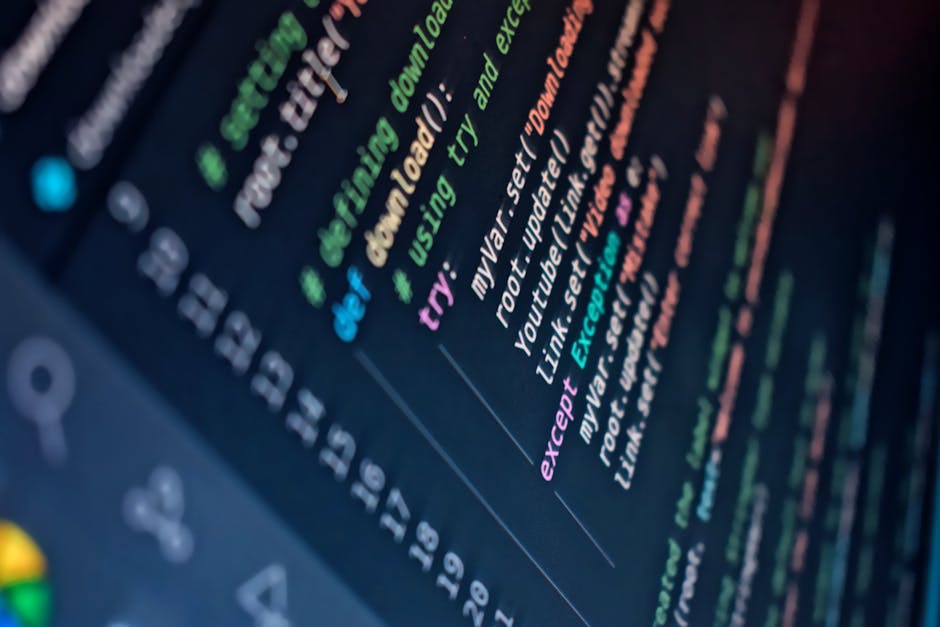 Close-up image of a computer screen displaying a programming code snippet with multiline text in different colors, including green, purple, and light blue, on a dark background. The code appears to in
